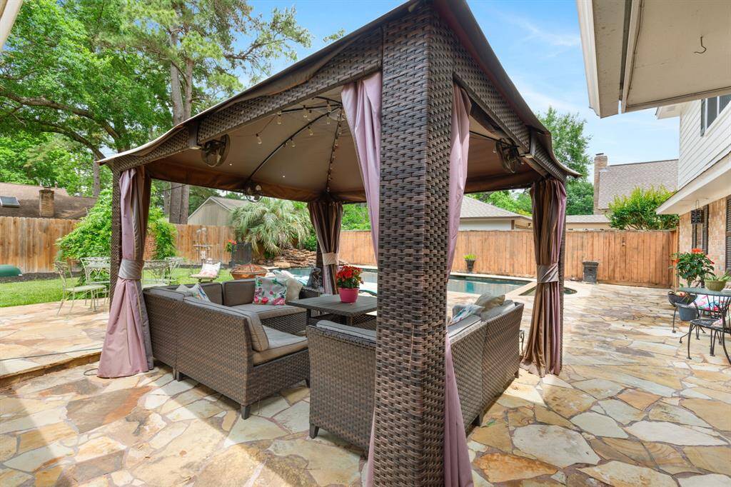 This covered cabana is the perfect place to relax next to the pool after a long day