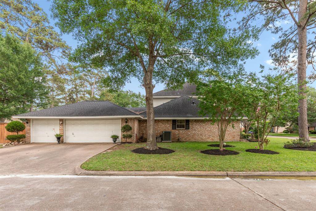 This large corner lot offers a ton of parking space and a huge 3 car garage