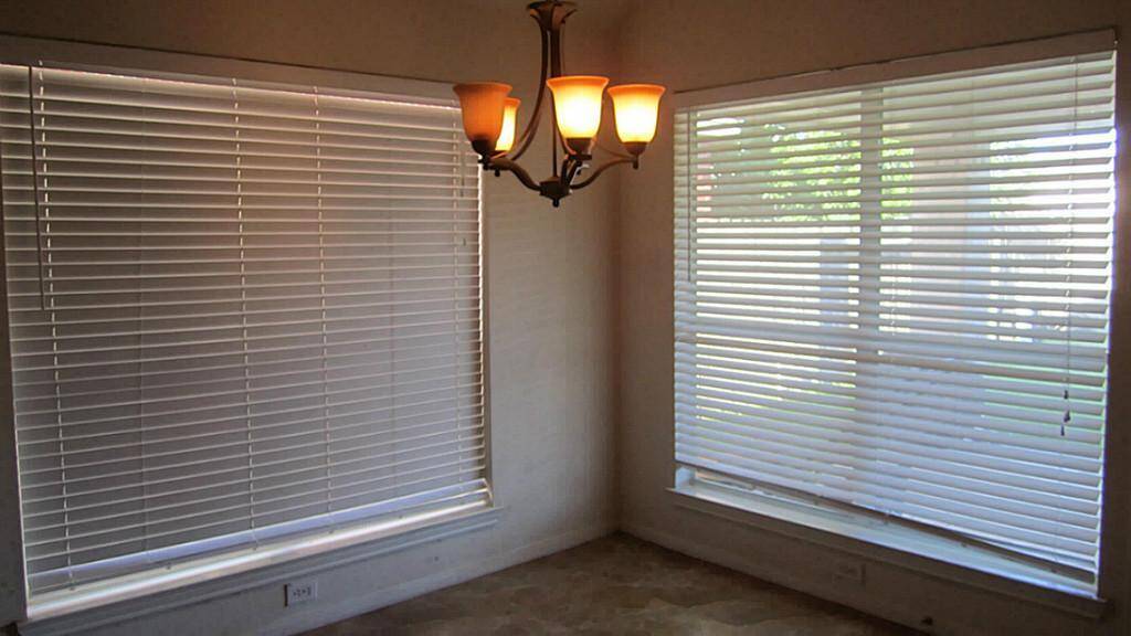 Breakfast area with updated light and tile floor