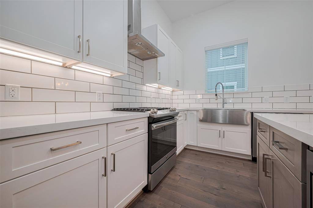 Kitchen subway backsplash and undercabinet lighting.