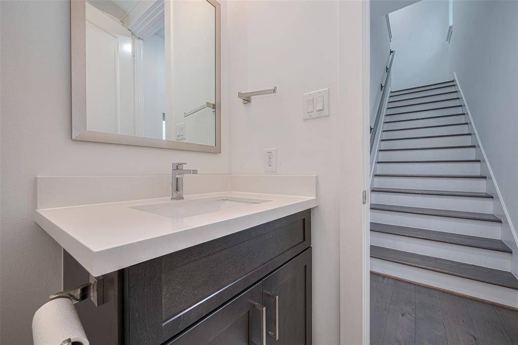 Second floor powder bathroom is tucked away for privacy.