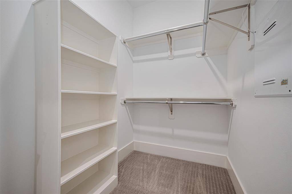 One of 2 walk-in closets of the primary bedroom.