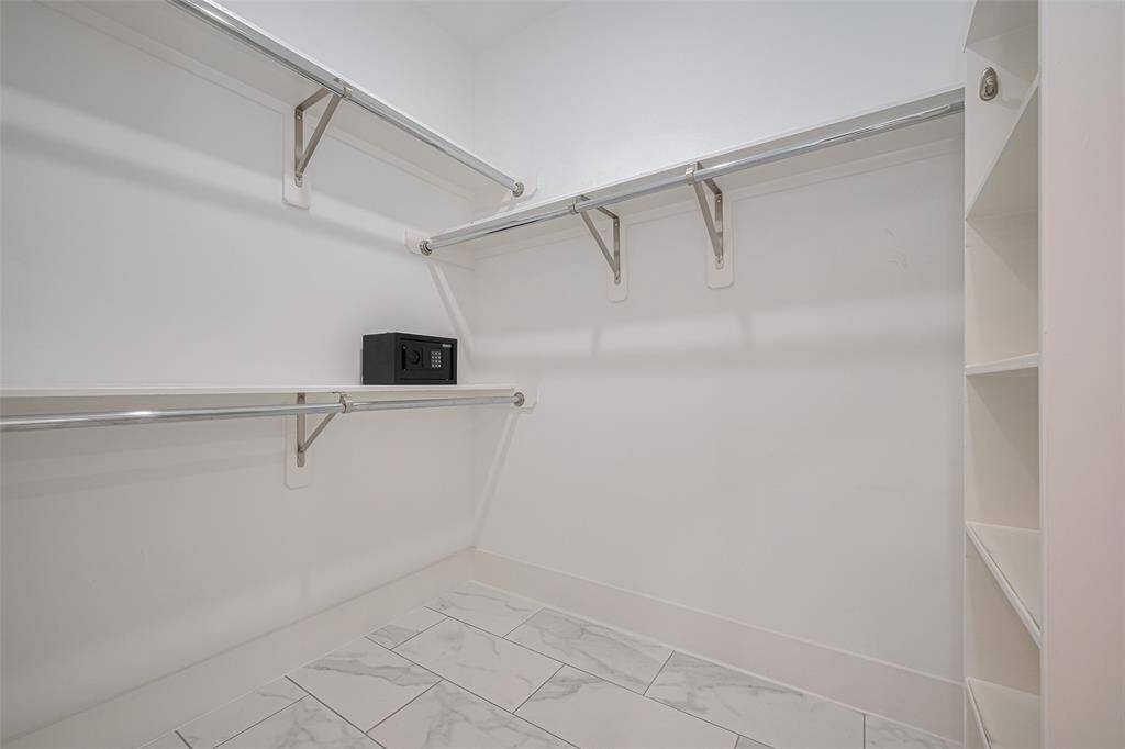 2nd walk-in closet for the primary bedroom. Plenty of space for your wardrobe needs.