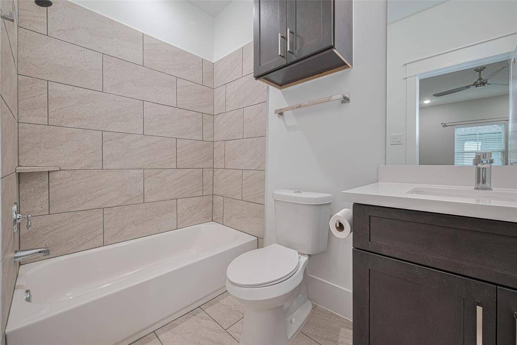 En suite bathroom for the upstairs secondary bedroom with shower/tub.