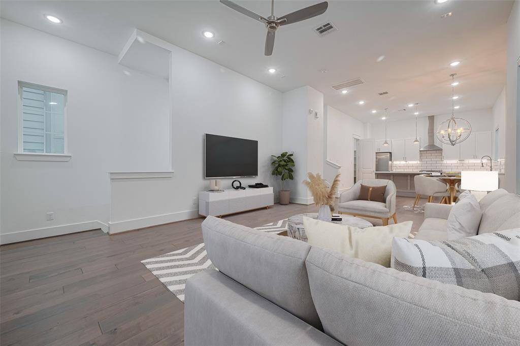 Living area easily fits your furniture to relax and enjoy TV entertainment. (Virtually Staged)