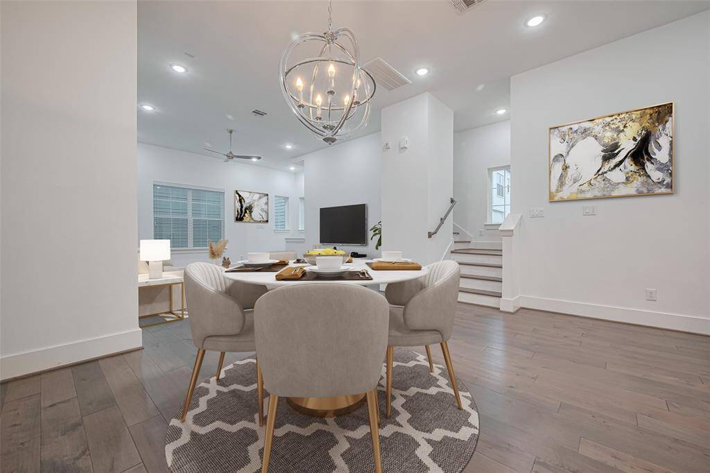 Entertain in style under this cool dining chandelier. (Virtually Staged)
