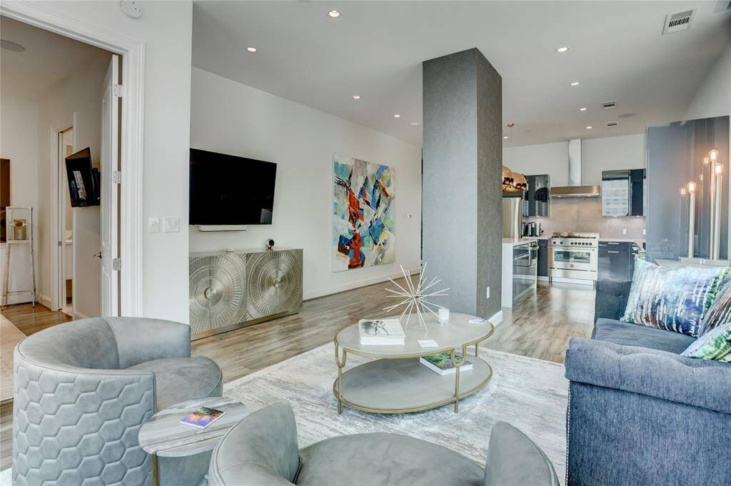 Welcome to Unit 1101 at the Marlowe. This 2-bedroom, 2.5-bath condo offers an open-concept floor plan filled with natural light and contemporary finishes. The spacious living area features wood flooring, recessed lighting that adds character and style.