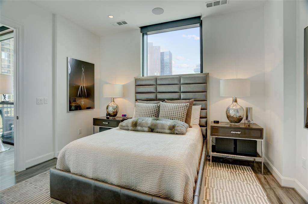 Another view of the spacious primary bedroom creating a bright and comfortable space to unwind.