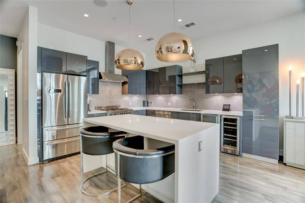 From this angle, you get a great view of the kitchen’s open layout, showcasing the oversized island and all the thoughtful details that make this space perfect for cooking and entertaining.