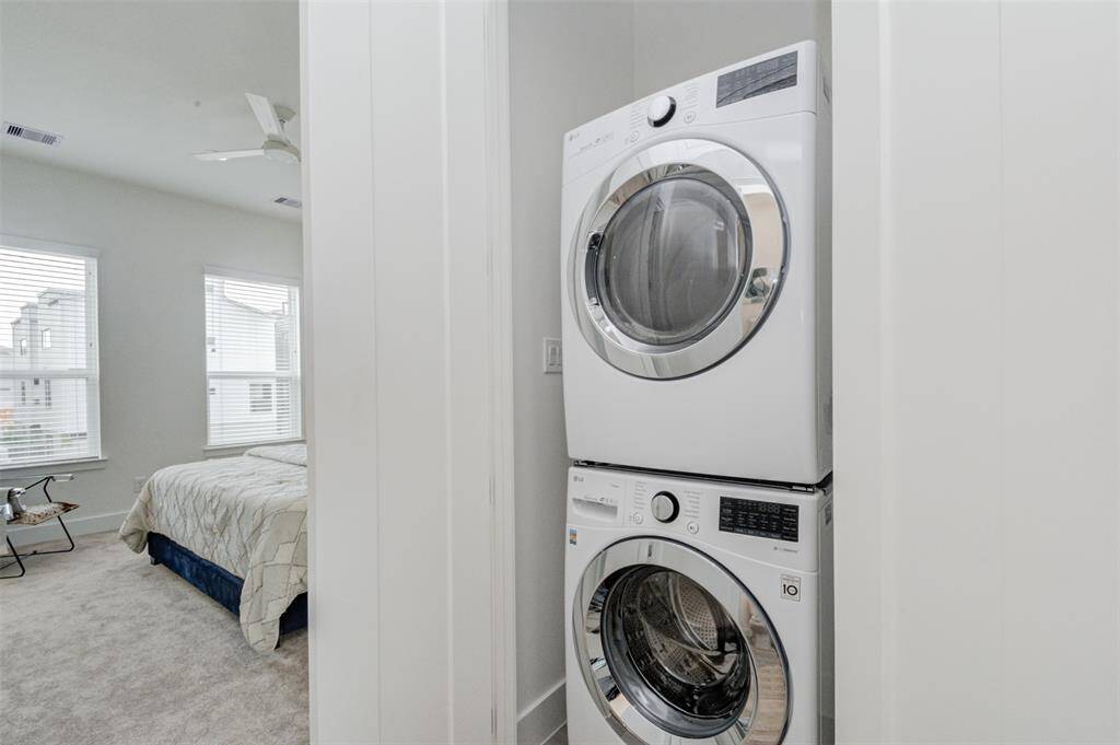 Washer and dryer across the powder room. The master bedroom is to the left.