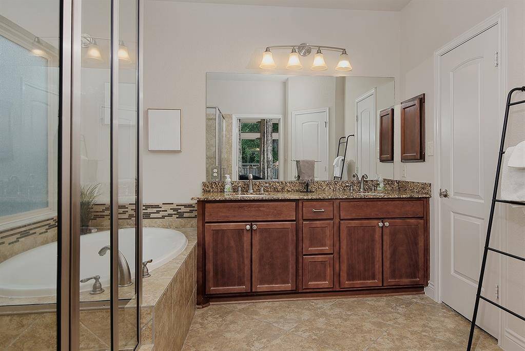 The primary bath offers a walk-in shower, soaking tub and double sinks