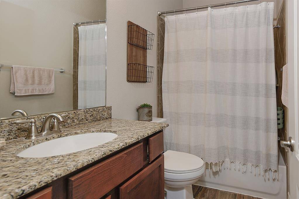 Secondary bedrooms share a bath with a tub/shower combo