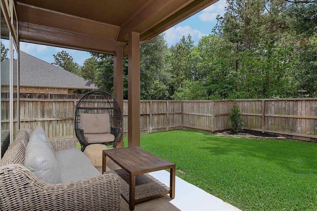 Expansive wooded views from the shady covered porch