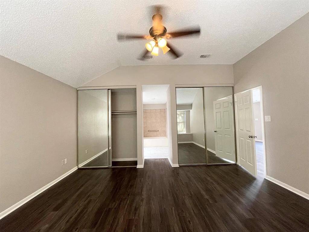 large closet with mirrors
