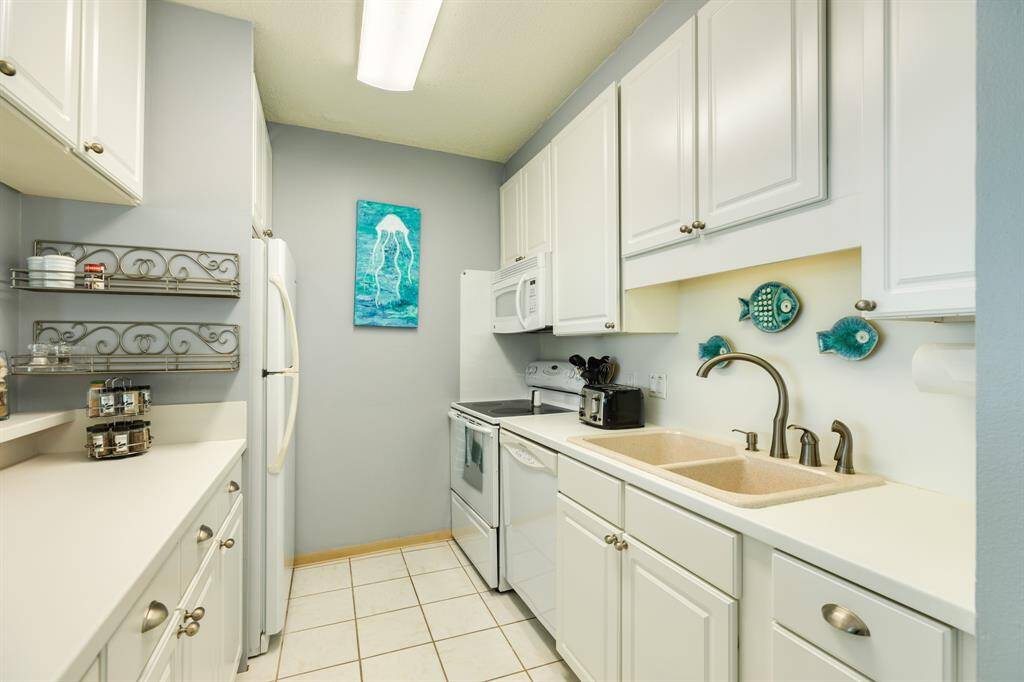 Galley kitchen has everything you need to enjoy beach living.