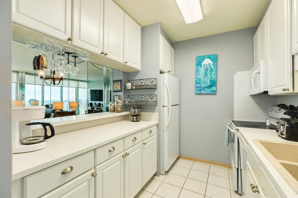 Another view of the kitchen and bar area