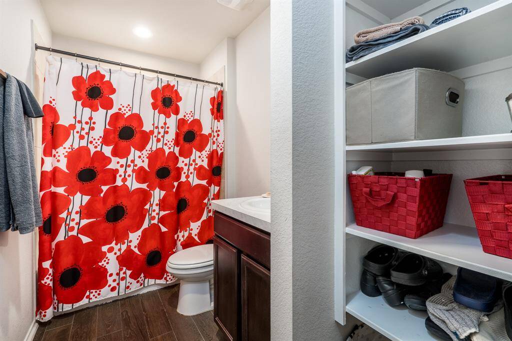The secondary bathroom sits at the front of the house just outside of the secondary bedrooms.
