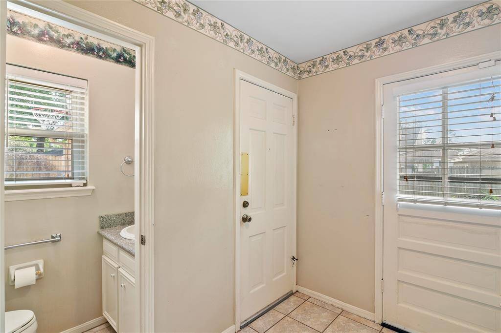 Large Utility Room doubles as mud room - entry from garage and backyard - Guest 1/2 Bath
