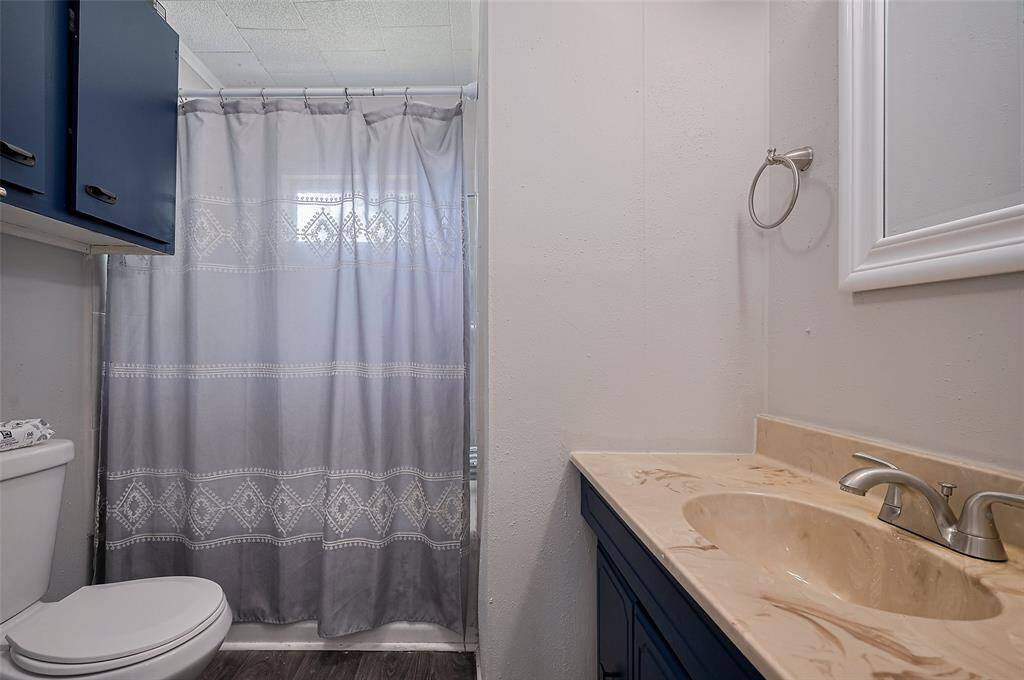 A full bathroom with a vanity adds functionality and convenience in a modest footprint.