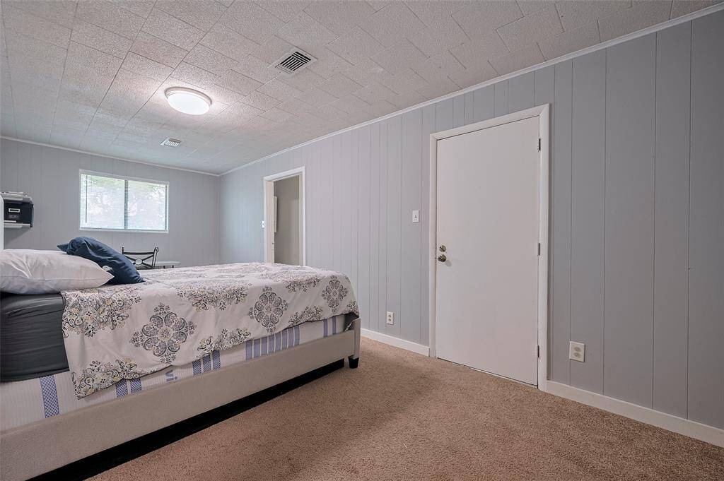 Another well-sized bedroom with plush carpeting awaits. Ample space for a desk or hobby corner makes this a flexible, multi-use room.