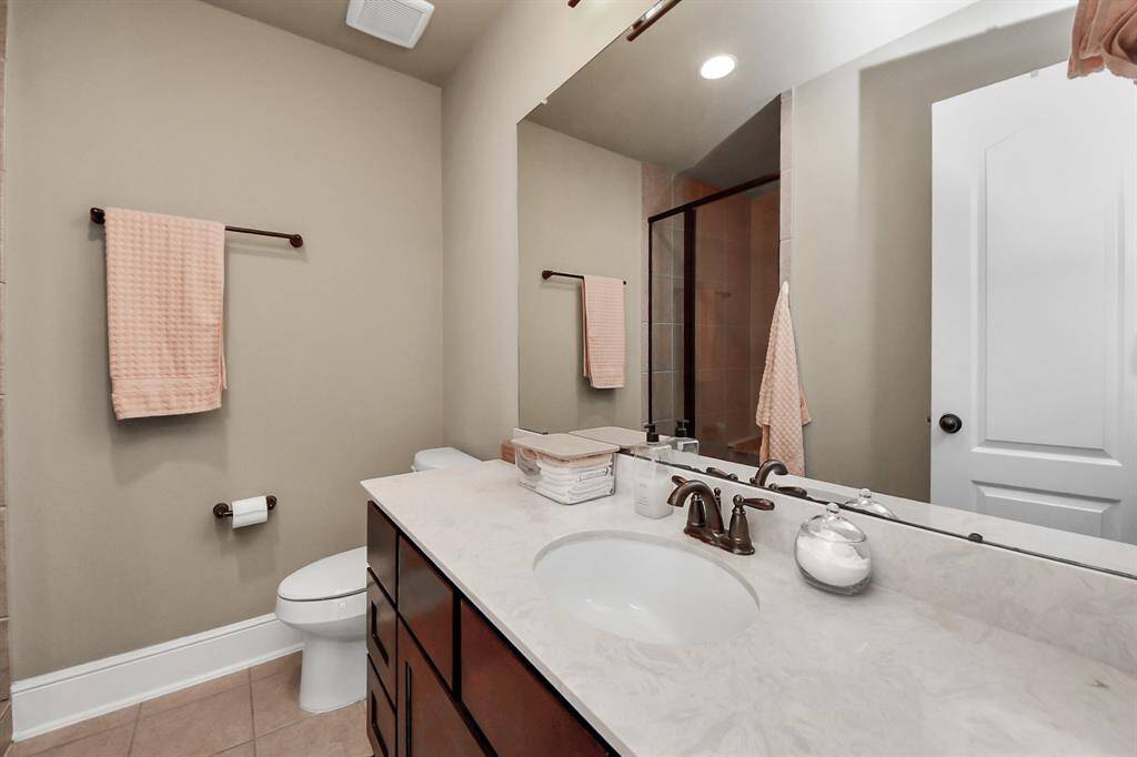 Elegant bathroom featuring a spacious walk-in shower.