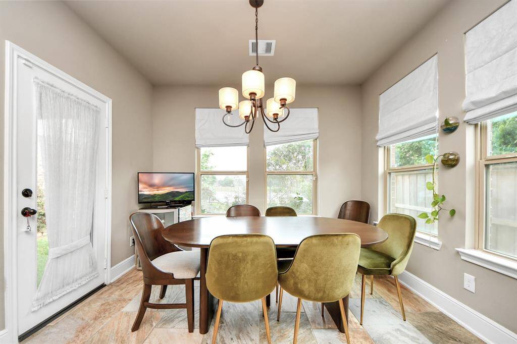 Spacious dining area with access to the backyard.