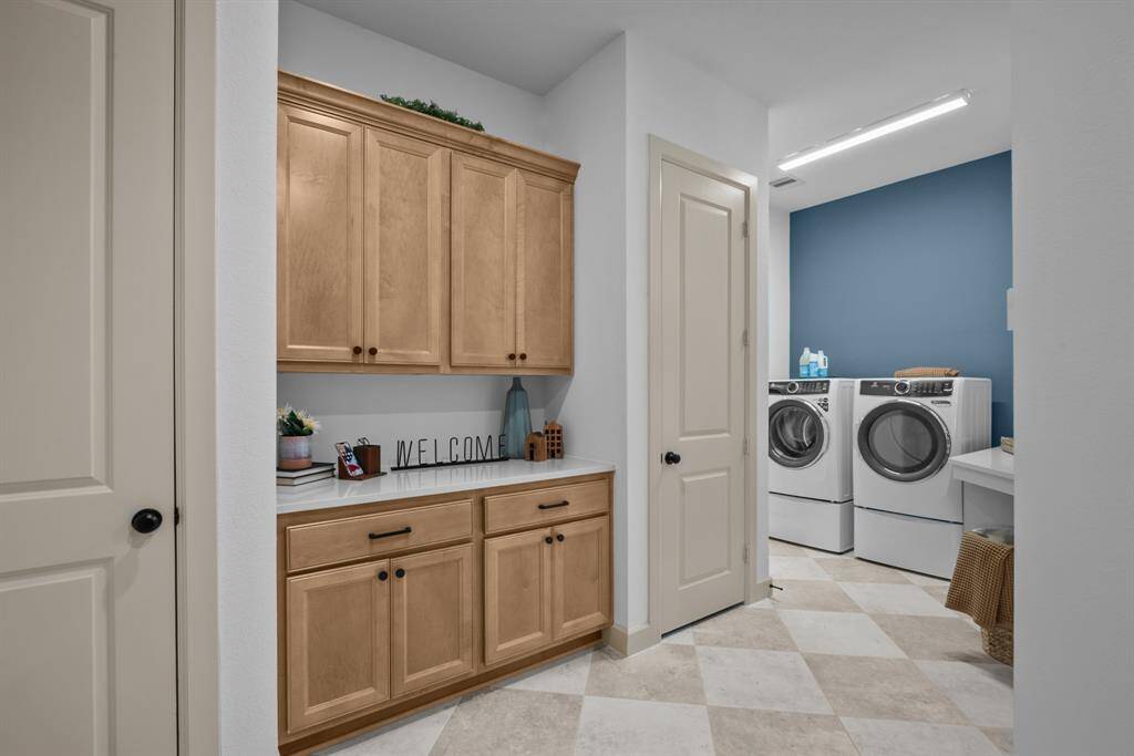 EXAMPLE PHOTO:  A great family foyer area as you come out of the garage!