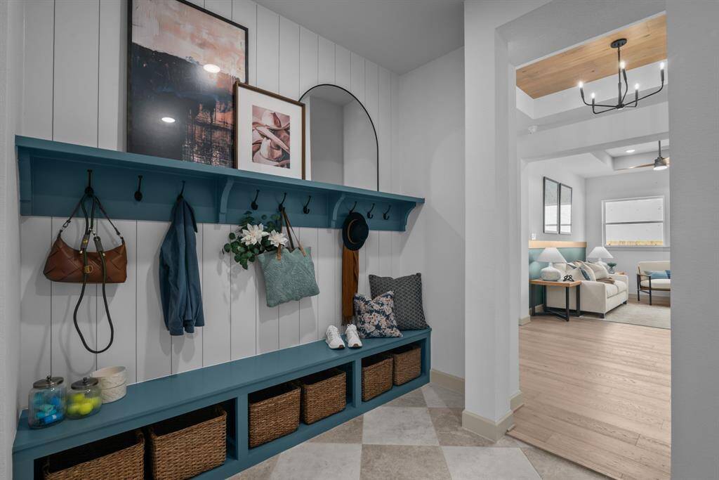 EXAMPLE PHOTO: Large Mudroom off Garage provides a great drop zone for the family!