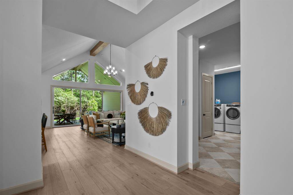 EXAMPLE PHOTO:  This is a WOW moment!  Bring the outside in w/this wide open hallway that gives you a view of the Living area that opens to a large Outdoor Living space