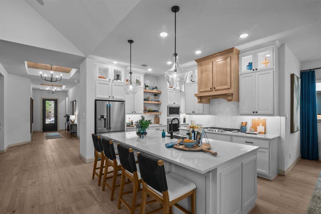 EXAMPLE PHOTO: High ceilings, low maintenance vinyl plank floors!