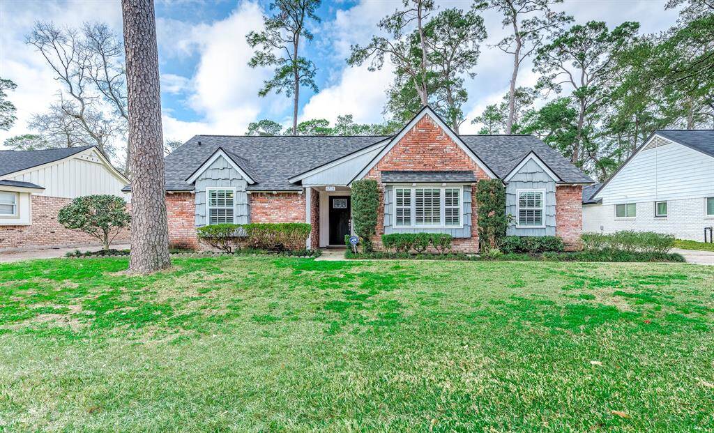Beautiful front exterior of the home on a quiet cul-de-sac street featuring a long driveway for guest parking.