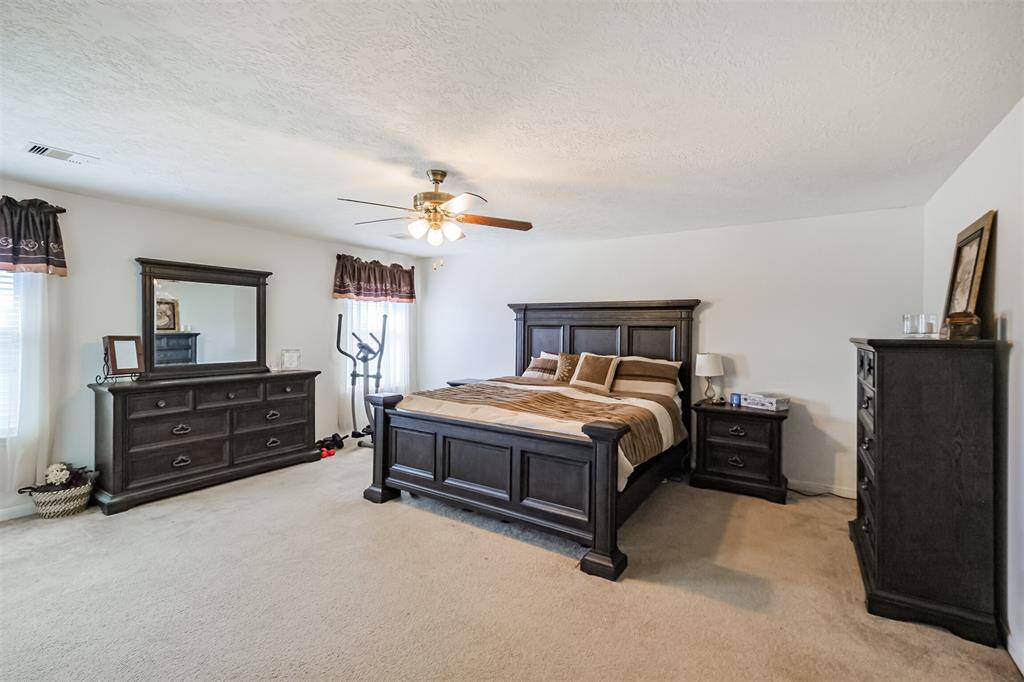 Primary bedroom has large windows for lots of natural light!
