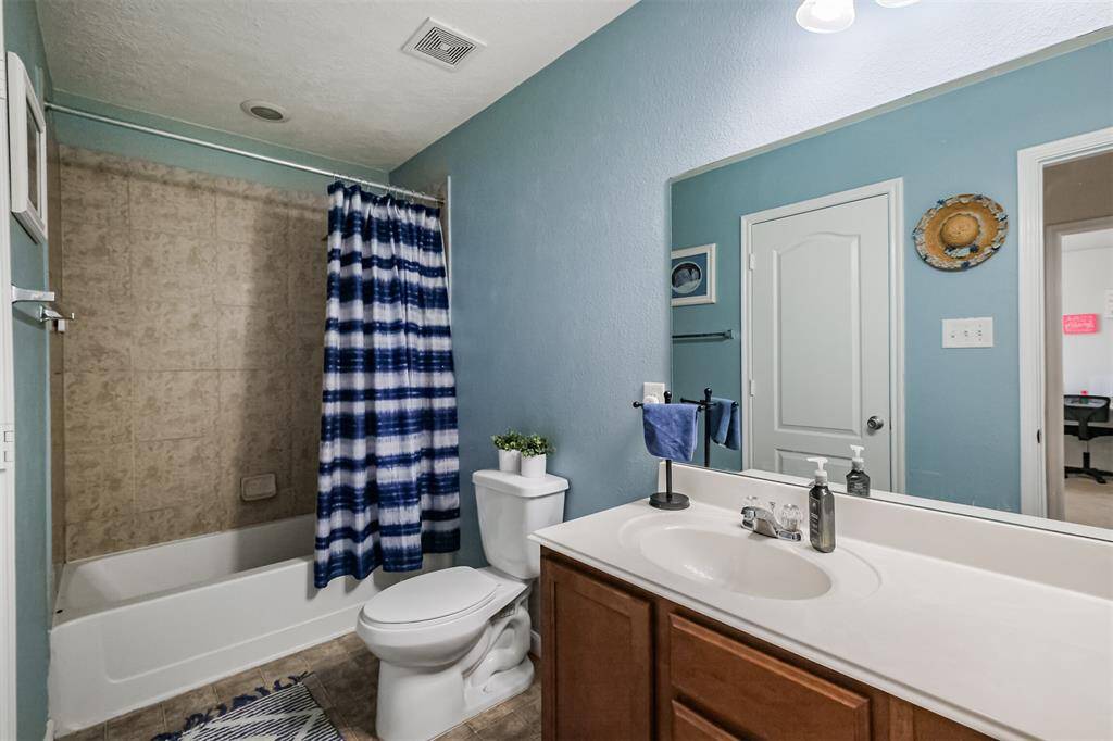 Hall Bath with shower/tub combo and extra long vanity