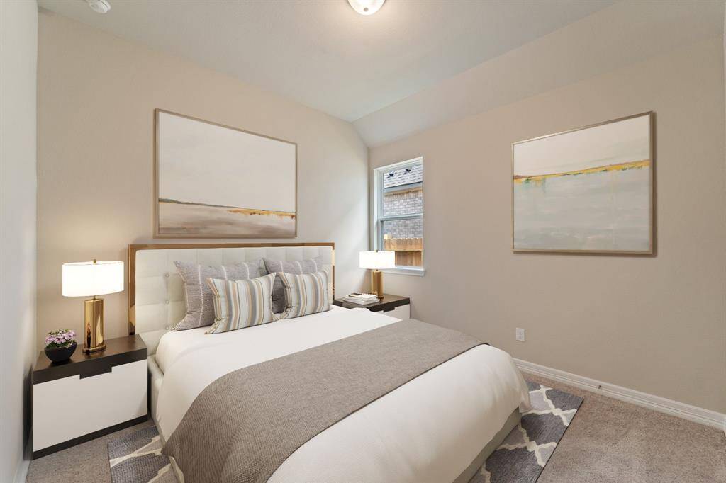Your secondary bedroom features plush carpet, fresh paint, closet, and a large window that lets in plenty of natural lighting.