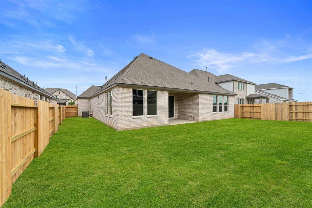 This backyard is perfect for family gatherings, social events, or simply unwinding in the fresh air.