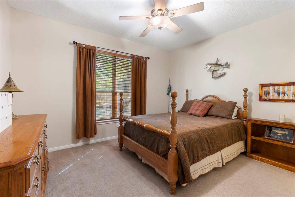 Discover the thoughtful layout of this home, where the secondary bedrooms are strategically located on the first floor in a separate wing, offering enhanced privacy and tranquility. This design ensures that family members or guests have their own secluded space, away from the main living areas. Each bedroom is spacious and inviting, providing a comfortable retreat for rest and relaxation. This arrangement not only maximizes privacy but also adds a layer of convenience and functionality.