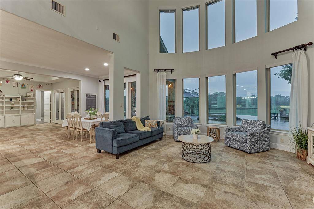 This particular floor plan offers a large sitting / sun room area next to the breakfast room that serves as an additional game room; it also offers the media room downstairs