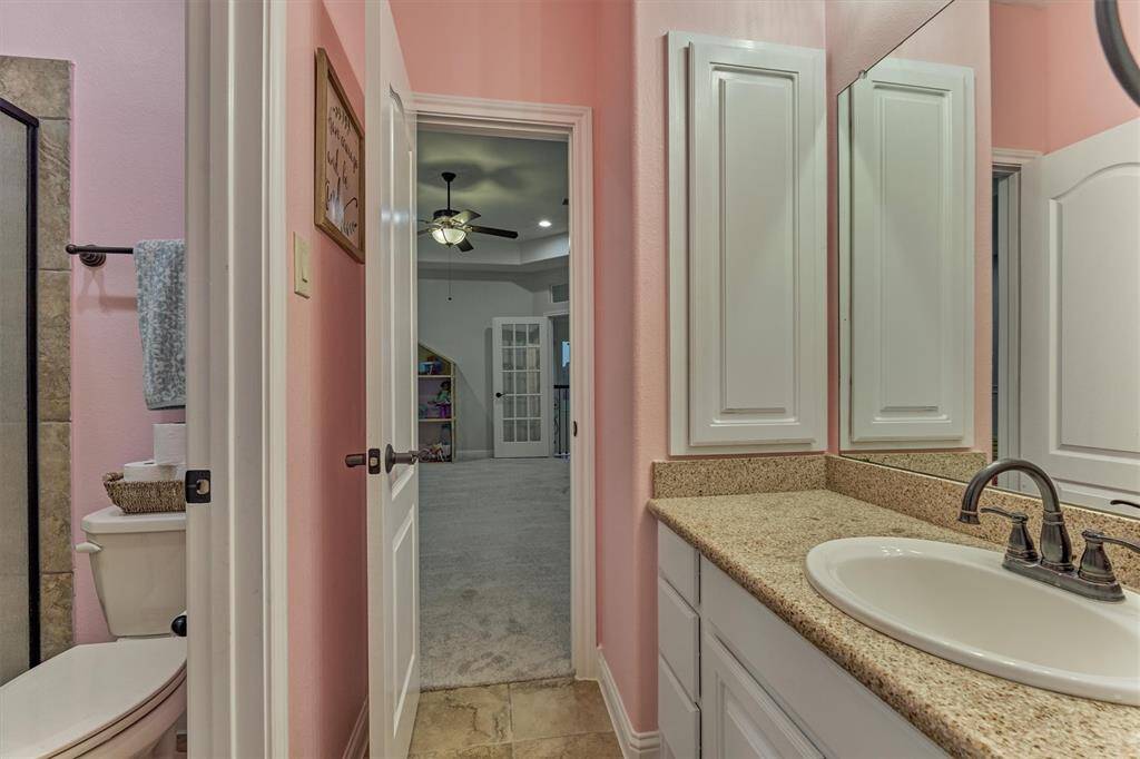 Full secondary bathroom also featuring granite countertops