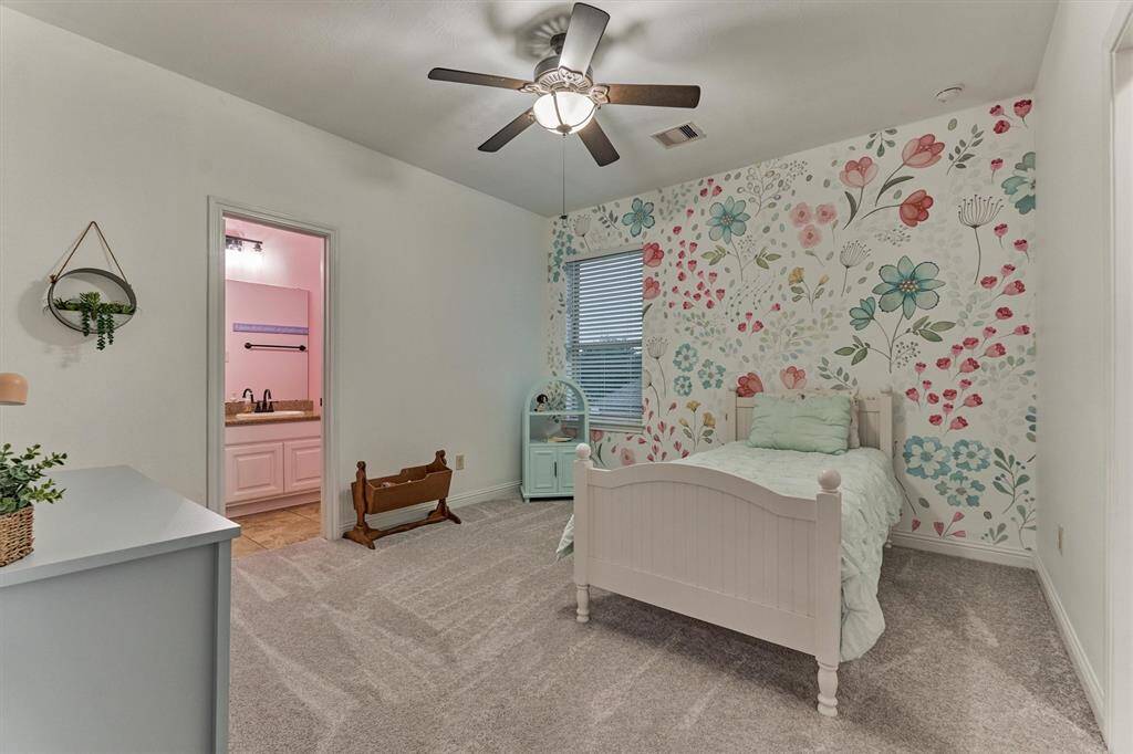 This is the second secondary bedroom upstairs also featuring an en-suite bathroom and a large walk in closet.