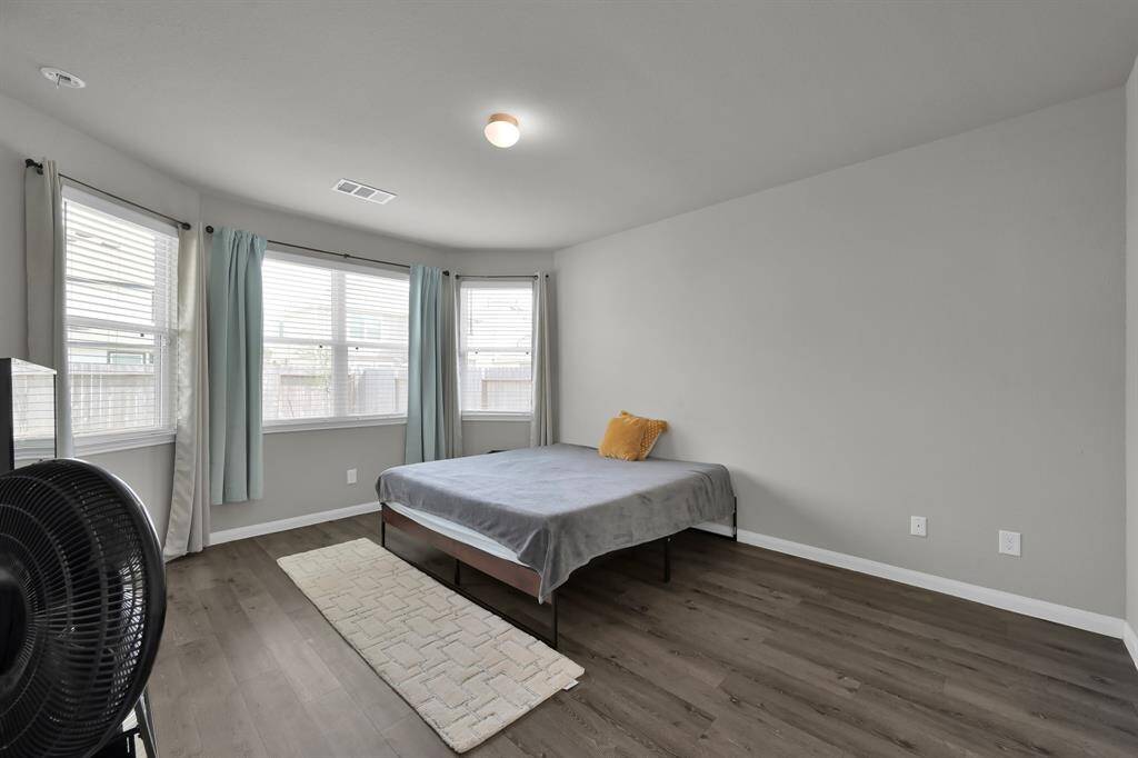 Light-filled primary bedroom.