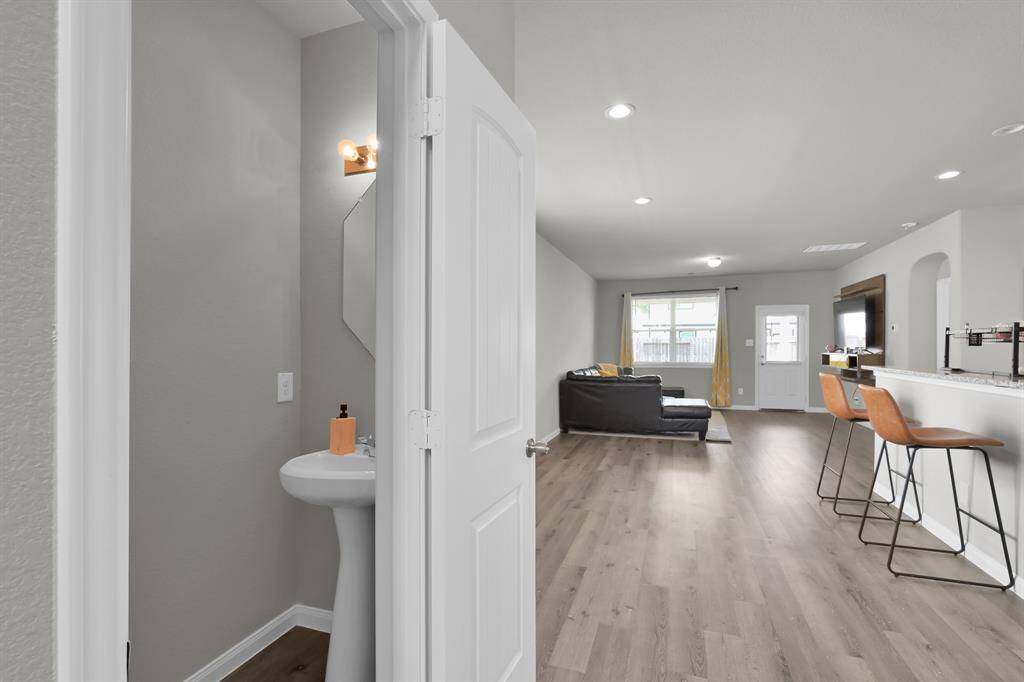 Convenient downstairs half-bathroom; open living area.