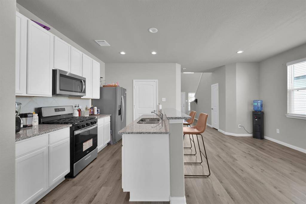Functional kitchen layout with ample cabinet space.