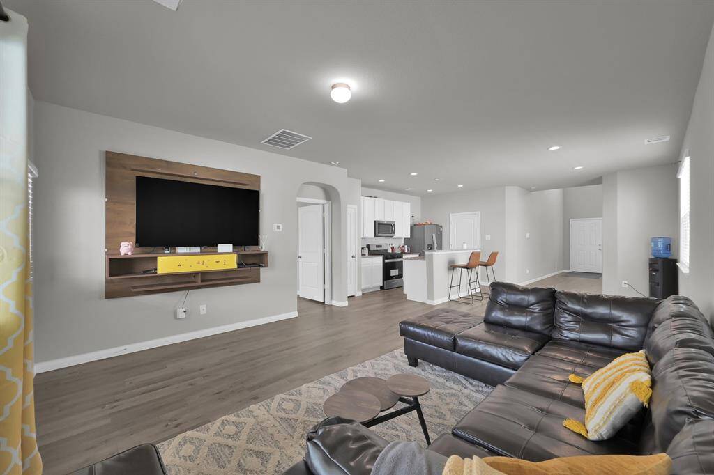 Expansive living area flows seamlessly to the kitchen.