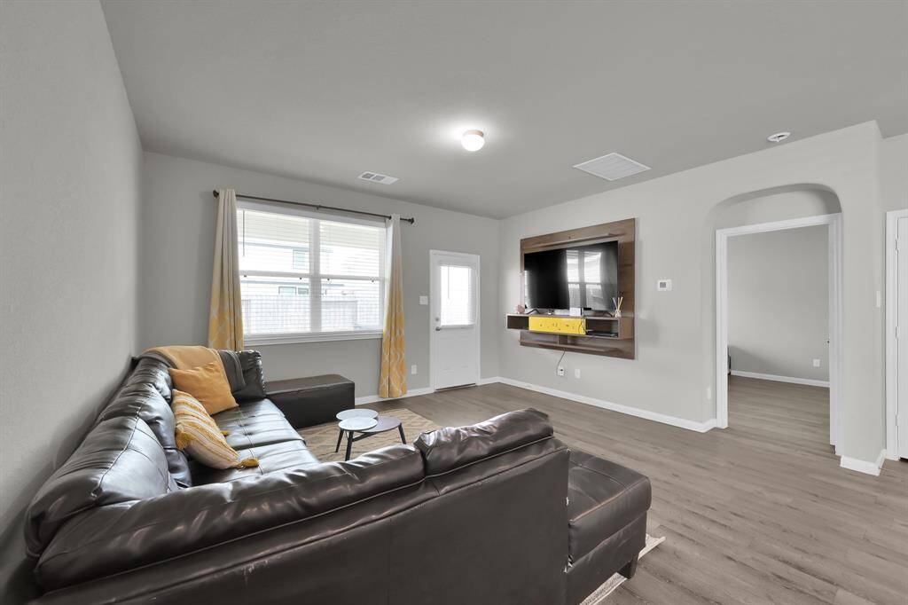 Comfortable living room with mounted TV.