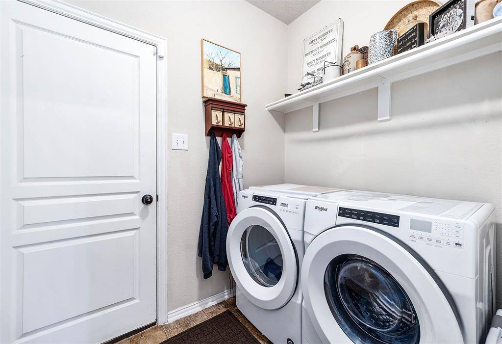 Spacious laundry room with ample storage.