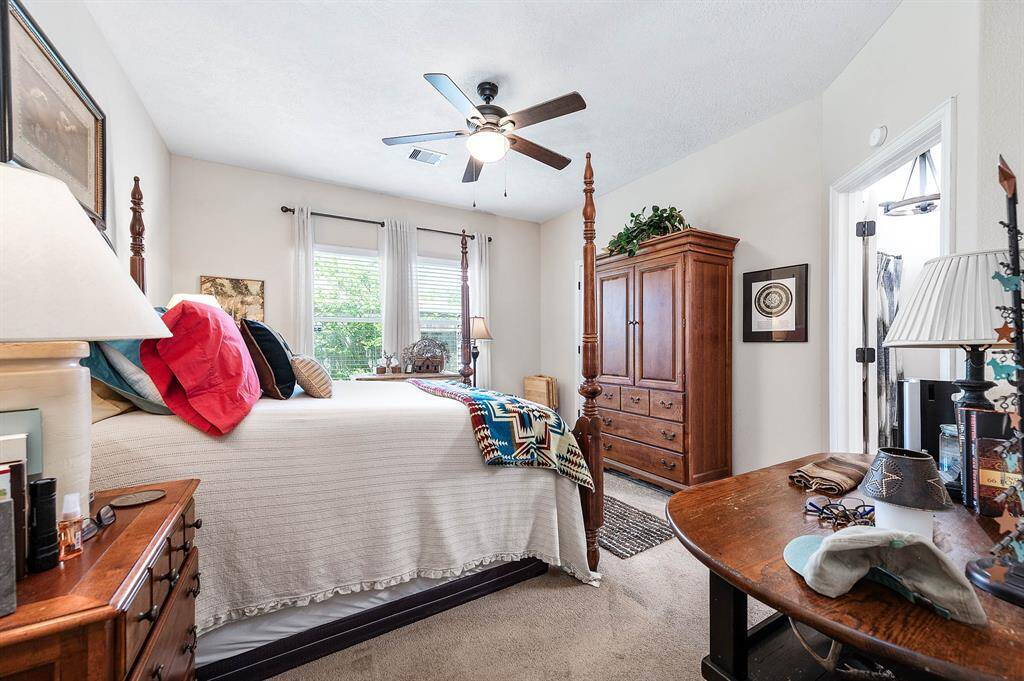 Spacious master bedroom with abundant natural light and elegant finishes.