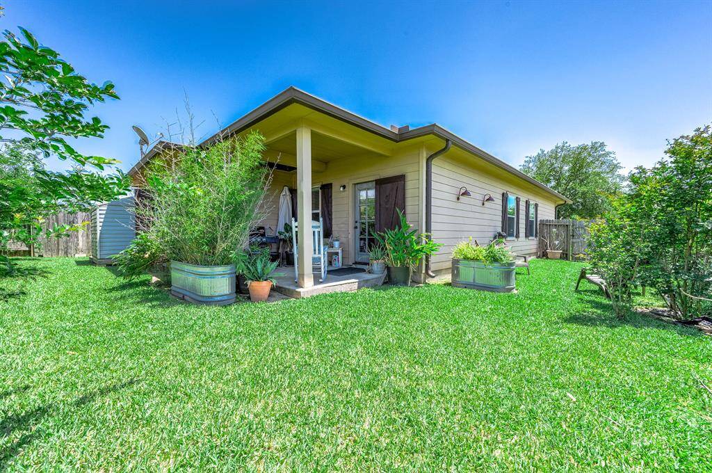 Tranquil backyard oasis with privacy-enhancing shutters.
