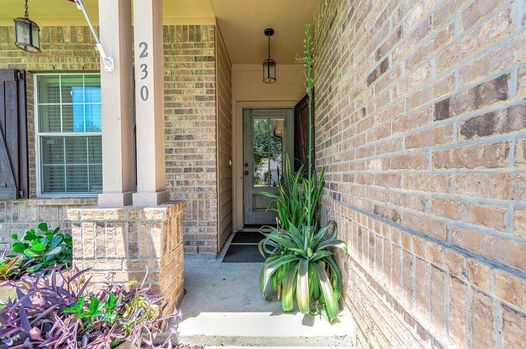 Charming home with stylish front and back door shutters for added curb appeal or storm protection