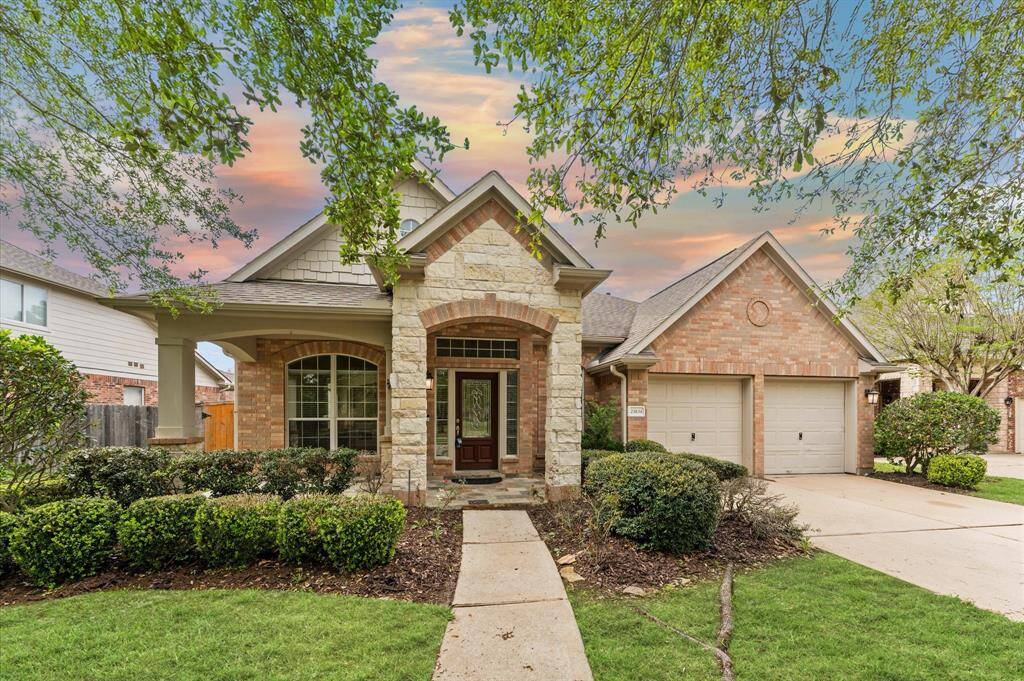 A lush, green front yard welcomes you home, setting a peaceful and inviting tone.