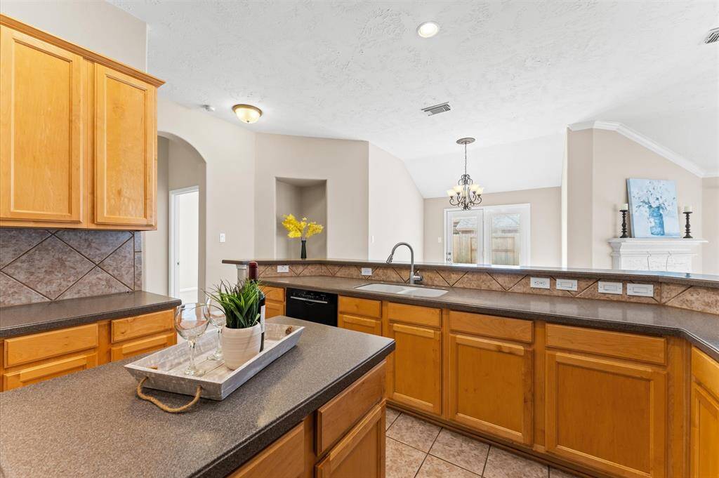 Rich cabinetry provides plenty of storage, keeping everything neat and organized.